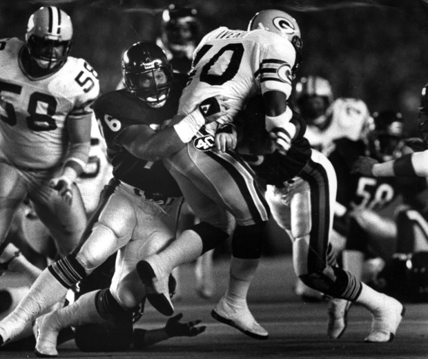 Bears' lineman Steve McMichael helps bring down Packer running back Eddie Field Lee Ivery during the first half of Monday's game in Soldier Field on Oct. 17, 1985. (Ed Wagner Jr./Chicago Tribune)