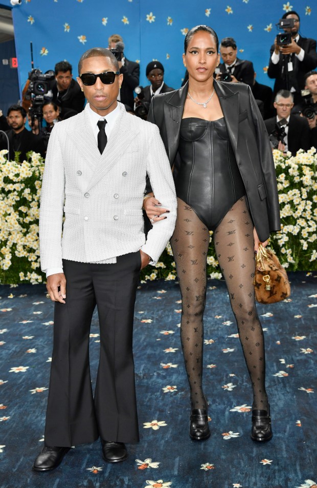 Pharrell Williams, left, and Helen Lasichanh attend The Metropolitan Museum of Art's Costume Institute benefit gala celebrating the opening of the "Superfine: Tailoring Black Style" exhibition on Monday, May 5, 2025, in New York. (Photo by Evan Agostini/Invision/AP)
