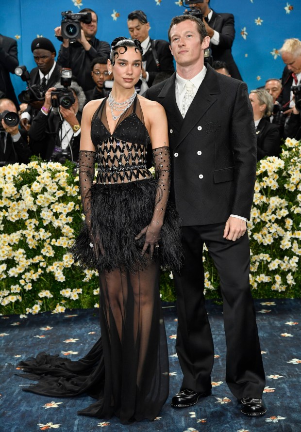 Dua Lipa, left, and Callum Turner attend The Metropolitan Museum of Art's Costume Institute benefit gala celebrating the opening of the "Superfine: Tailoring Black Style" exhibition on Monday, May 5, 2025, in New York. (Photo by Evan Agostini/Invision/AP)