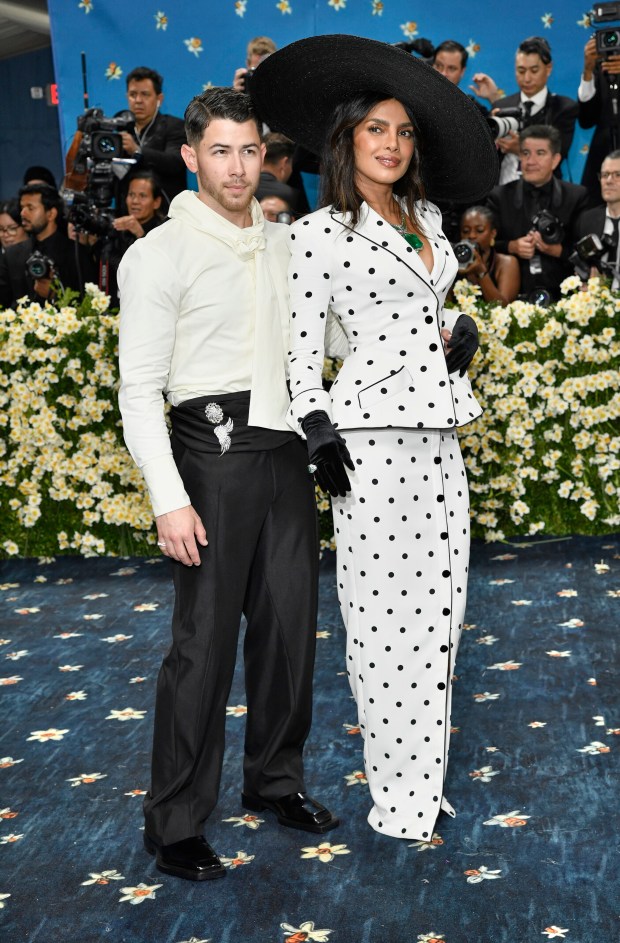 Nick Jonas, left, and Priyanka Chopra attend The Metropolitan Museum of Art's Costume Institute benefit gala celebrating the opening of the "Superfine: Tailoring Black Style" exhibition on Monday, May 5, 2025, in New York. (Photo by Evan Agostini/Invision/AP)