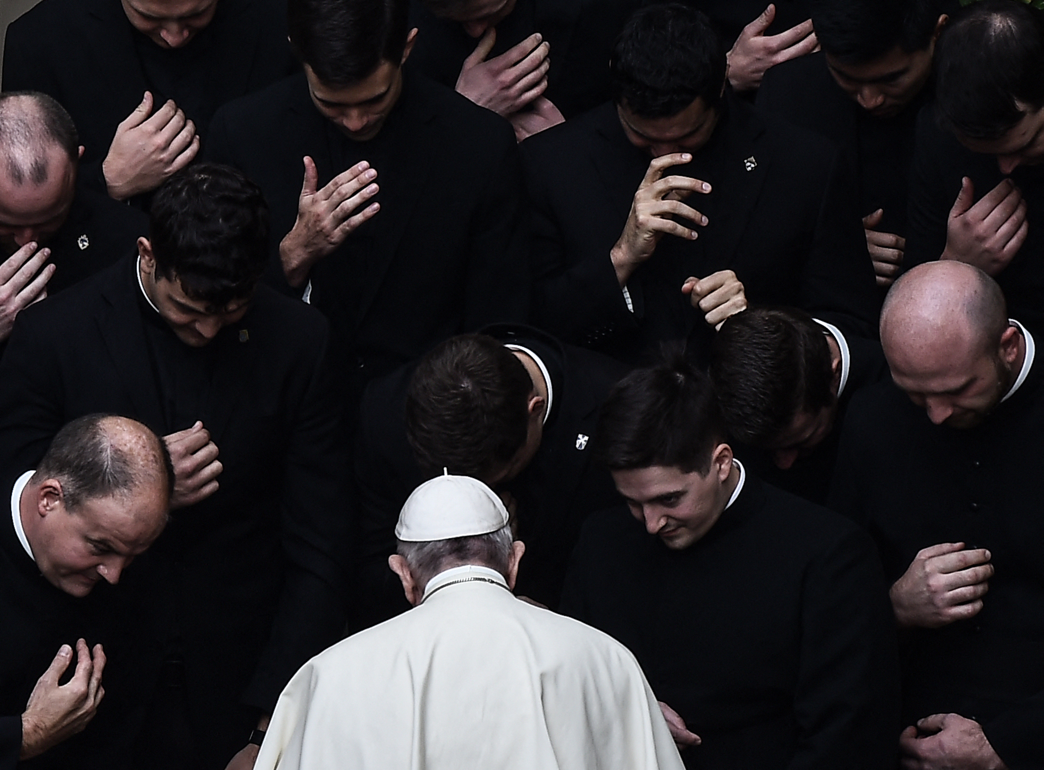 Pope Francis prays with priests at the end of a limited public audience at the San Damaso courtyard in The Vatican on Sept. 30, 2020 during the COVID-19 infection, caused by the novel coronavirus. (Filippo Monteforte/Getty-AFP)