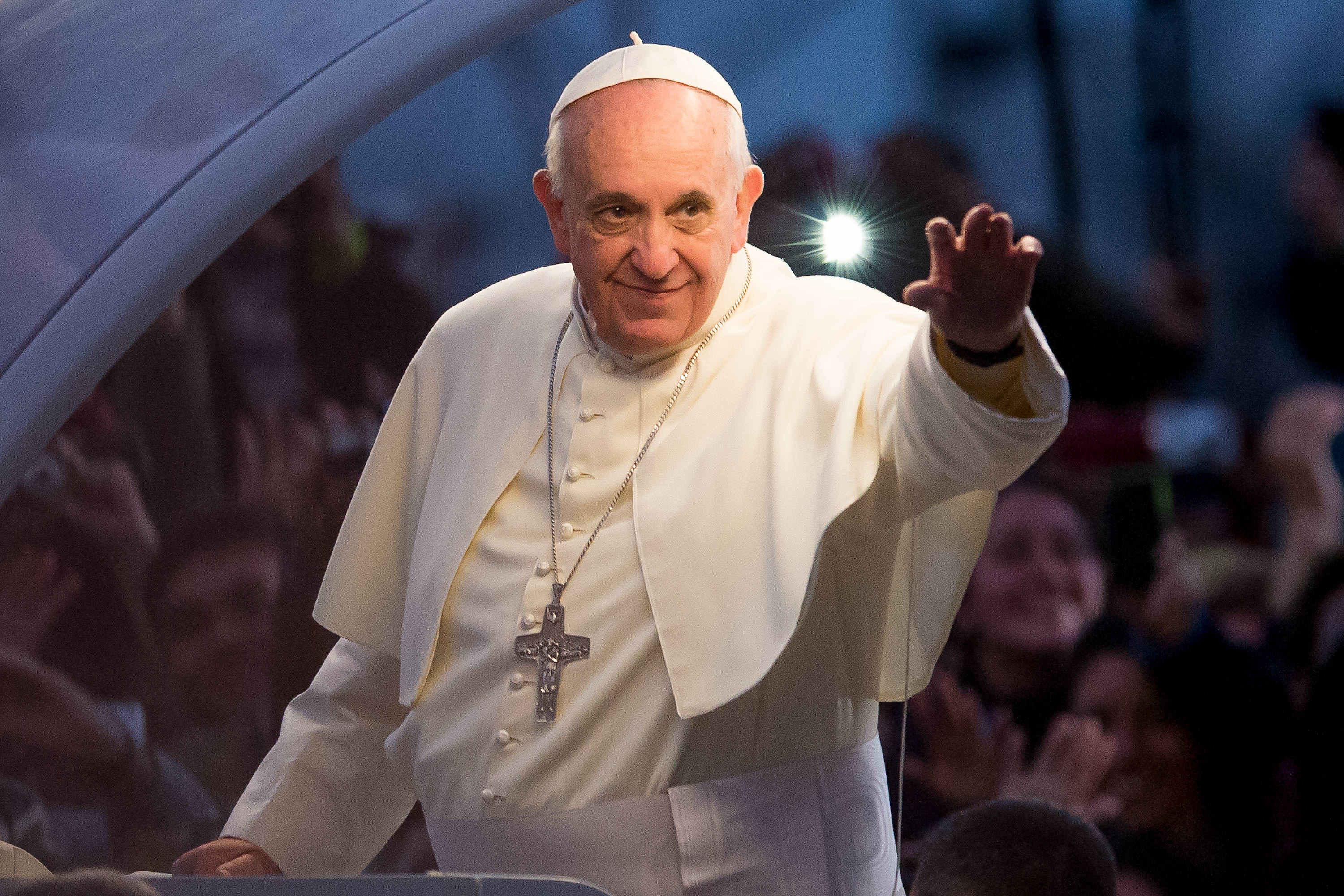 Pope Francis waves from the Popemobile on his way to attend the Via Crucis on Copacabana Beach during World Youth Day celebrations on July 26, 2013 in Rio de Janeiro, Brazil. More than 1.5 million pilgrims are expected to join the pontiff for his visit to the Catholic Church's World Youth Day celebrations which is running July 23-28. (Buda Mendes/Getty)