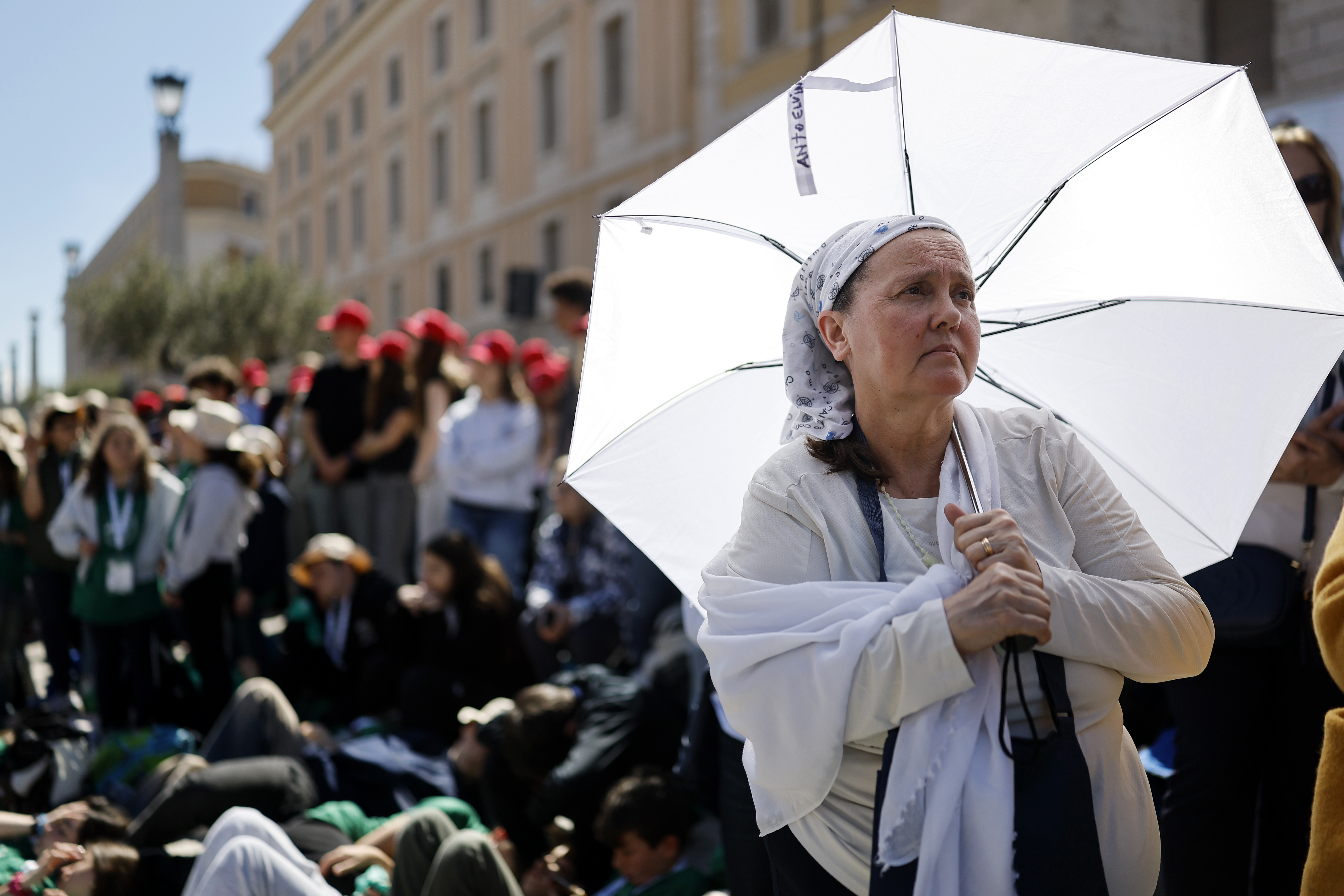 Members of the faithful gather during the funeral of Pope Francis in Via della Conciliazione on April 26, 2025 in Rome, Italy. Pope Francis died on April 21st at the age of 88. Born in Argentina as Jorge Mario Bergoglio, he was the first Latin American and the first Jesuit to become Pope when elected in 2013. Taking the name Francis after St Francis of Assisi, he promoted a more humble version of the papacy than many of his predecessors. He will be buried outside of the Vatican in a simple wooden coffin at the Basilica Santa Maria Maggiore. (Photo by Mario Tama/Getty Images)