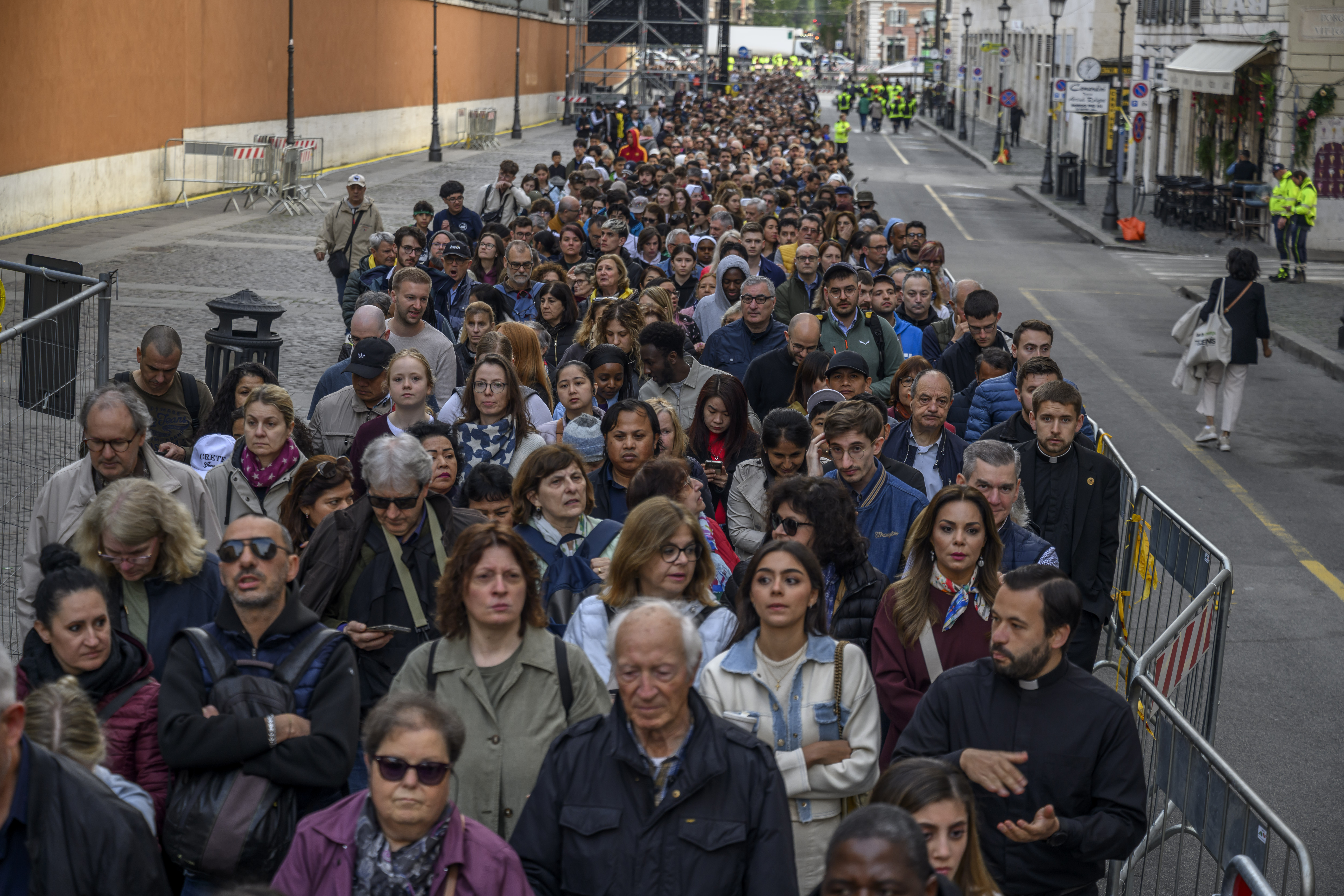 Faithful join a long line outside St Peter's Square to view the body of Pope Francis laying in state inside St Peter's Basilica, on April 25, 2025 in Vatican City, Vatican. Pope Francis, who died on April 21 aged 88, is lying in state for a final day ahead of tomorrow's funeral in St. Peter's Square. (Photo by Antonio Masiello/Getty Images)