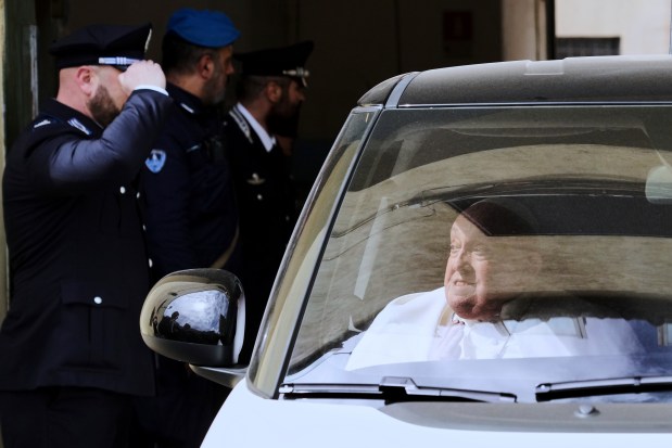 Pope Francis leaves in a car at the end of his visit on Holy Thursday to the Regina Coeli penitentiary in Rome, April 17, 2025. (Andrew Medichini/AP)