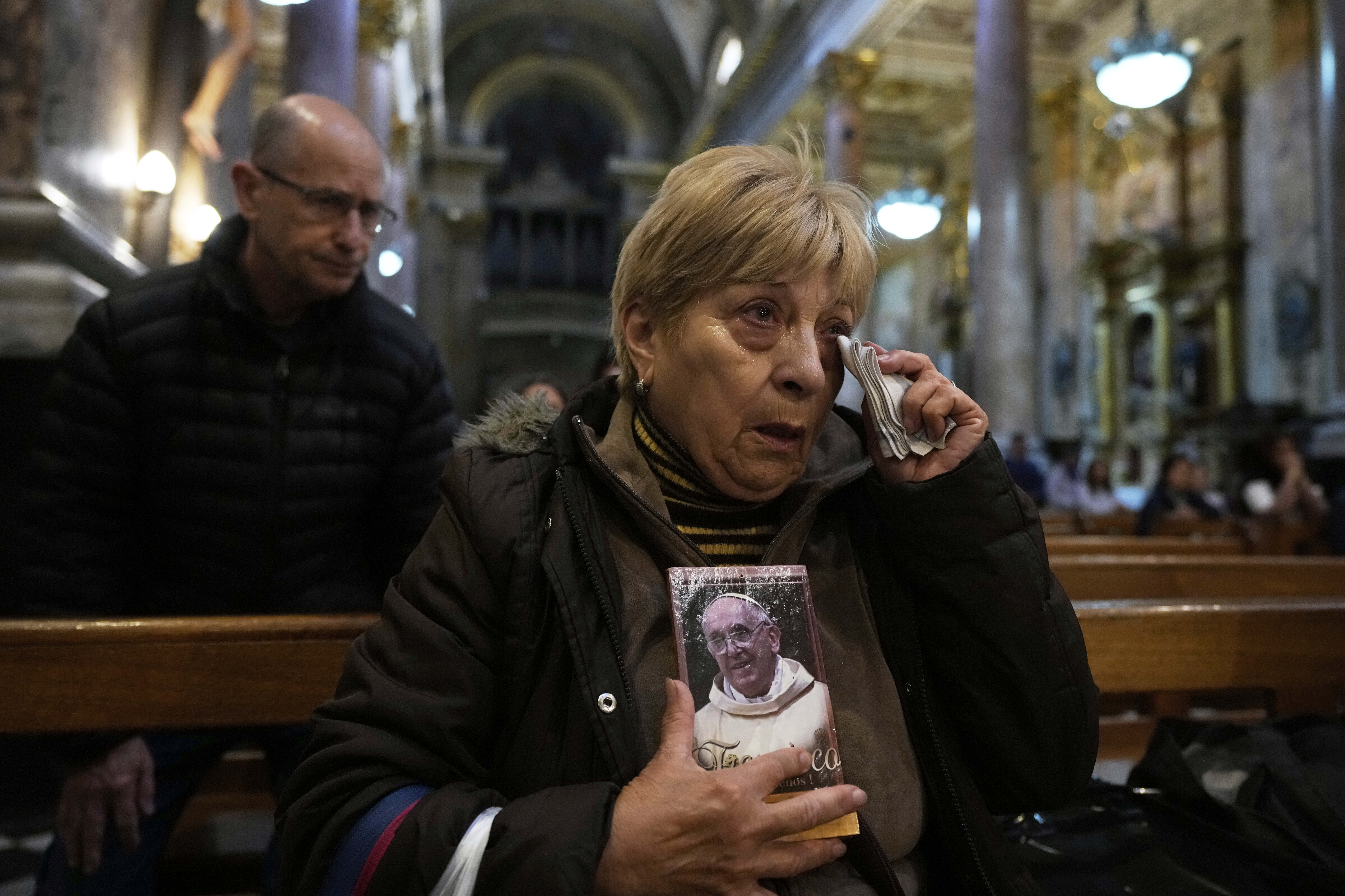 A faithful holds a portrait of the late Pope Francis during Mass at the Basílica de San José de Flores, where he worshipped as a youth, following the Vatican's announcement of his death in Buenos Aires, Argentina, April 21, 2025. (Gustavo Garello/AP)