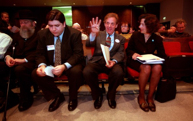 9th Congressional District candidates JB Pritzker, left, state Sen. Howard Carroll and state Rep. Jan Schakowsky wait for their cue to step onto a stage at the beginning of a debate on Jan. 25, 1998, at the Ezra Habonim Synagogue in Skokie. (John Lee/Chicago Tribune)