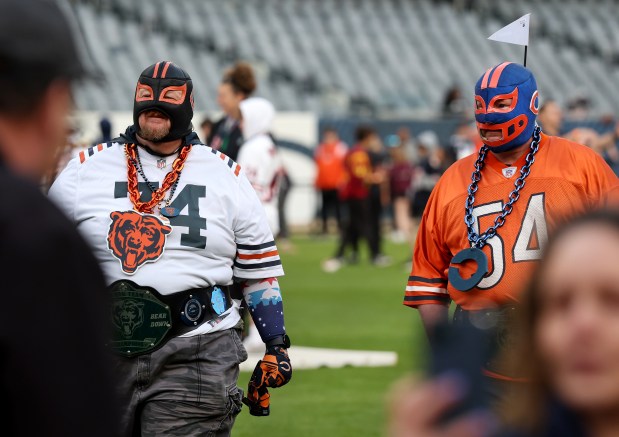 Bears fans wearing Mexican wrestling masks attend the Bears draft party on Thursday, April 24, 2025, at Soldier Field. (Chris Sweda/Chicago Tribune)