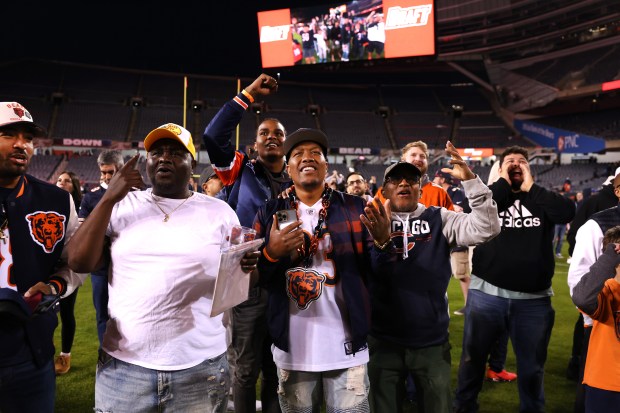 Fans attending a Bears draft party at Soldier Field react after it was announced the team selected Michigan tight end Colston Loveland with the No. 10 pick on April 24, 2025. (Chris Sweda/Chicago Tribune)
