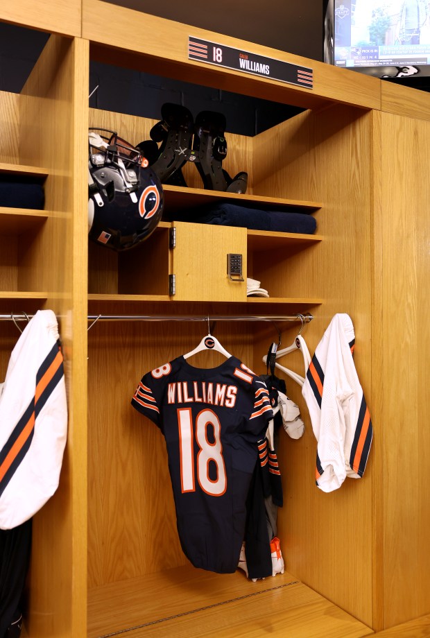 Quarterback Caleb Williams' jersey hangs as fans tour the locker room during the Bears draft party at Soldier Field on April 24, 2025. (Chris Sweda/Chicago Tribune)