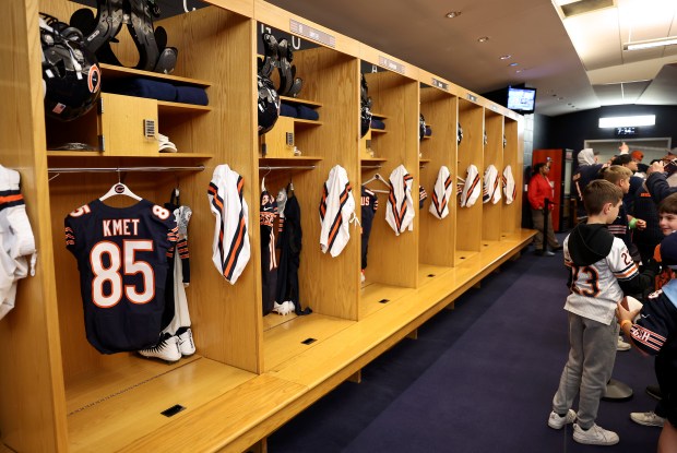 The jersey of tight end Cole Kmet hangs in the Bears locker room as fans attend a draft party at Soldier Field on April 24, 2025. (Chris Sweda/Chicago Tribune)