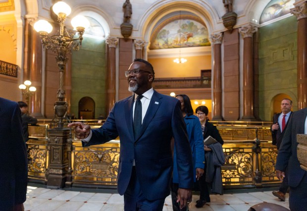 Mayor Brandon Johnson greets people at the Illinois State Capitol while meeting with lawmakers, April 30, 2025, in Springfield. (Brian Cassella/Chicago Tribune)