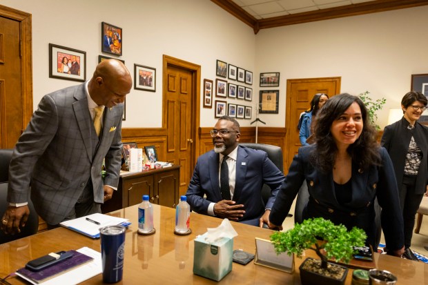 House Speaker Emanuel "Chris" Welch welcomes Mayor Brandon Johnson and his chief of staff Cristina Pacione-Zayas to his office for a meeting at the Illinois State Capitol on April 30, 2025, in Springfield. (Brian Cassella/Chicago Tribune)