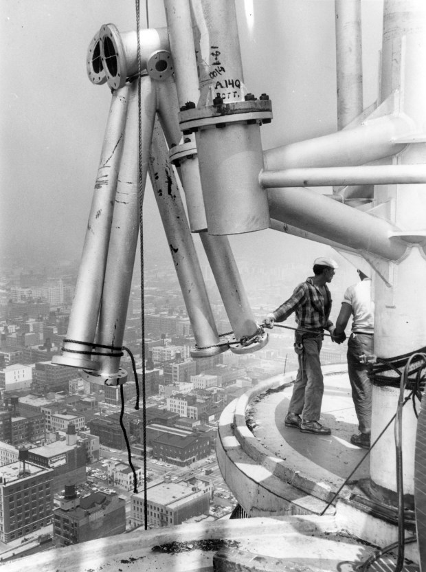 Jogn Rukavina, left, helps assemble a television antenna 61 stories above street level atop Marina City in July, 1964. (Steve Lasker/Chicago American)