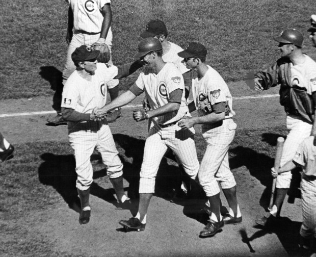 Chicago Cubs Manager Leo Durocher greets Jim Hickman with a handshake after the outfielder's game-winning home run on June 26, 1969. (Steve Lasker/Chicago Today)