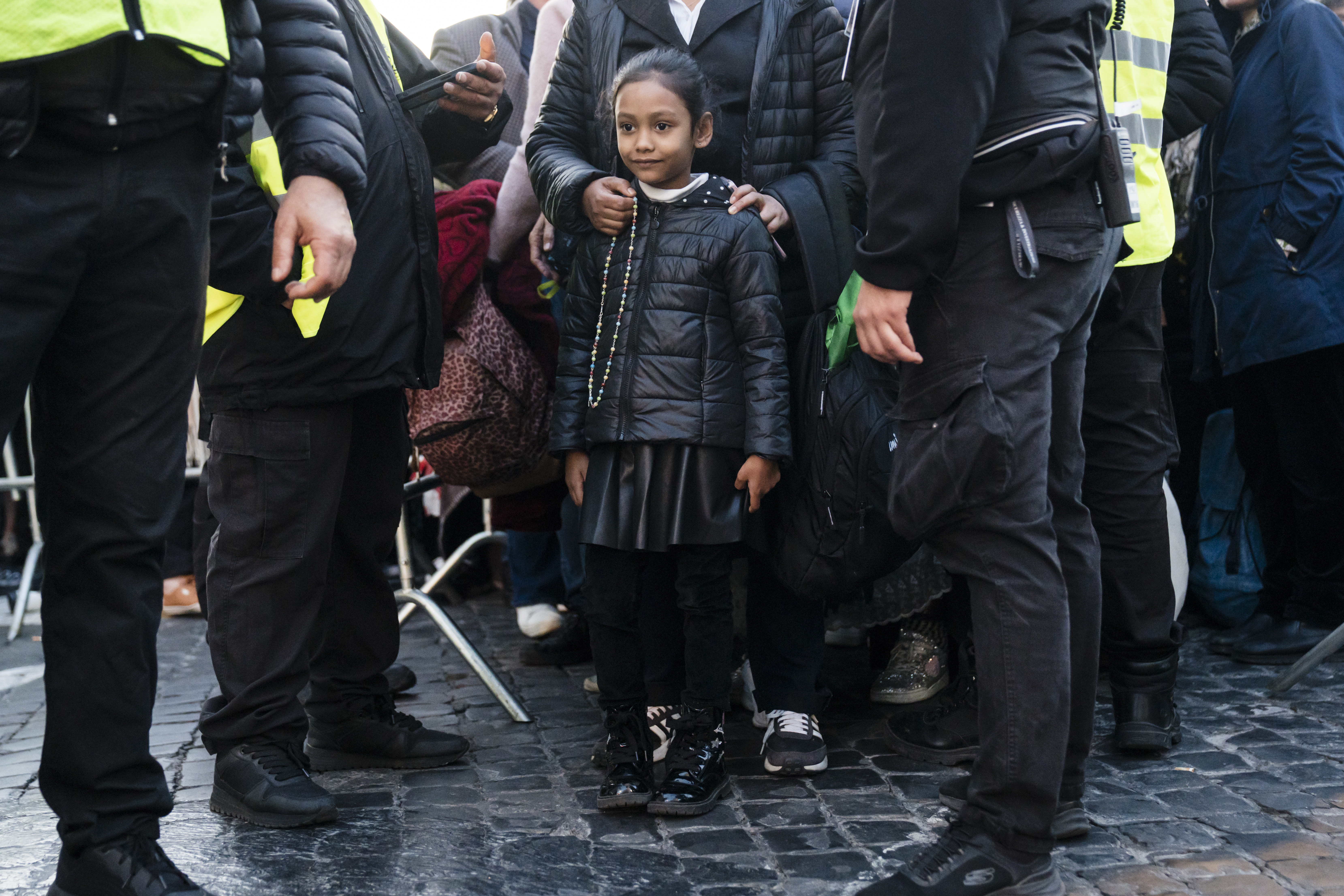 A girl, among the first in a line of thousands, waits to enter St. PeterÕs Square for the funeral of Pope Francis at the Vatican on Saturday, April 26, 2025. (Gianni Cipiriano/The New York Times)