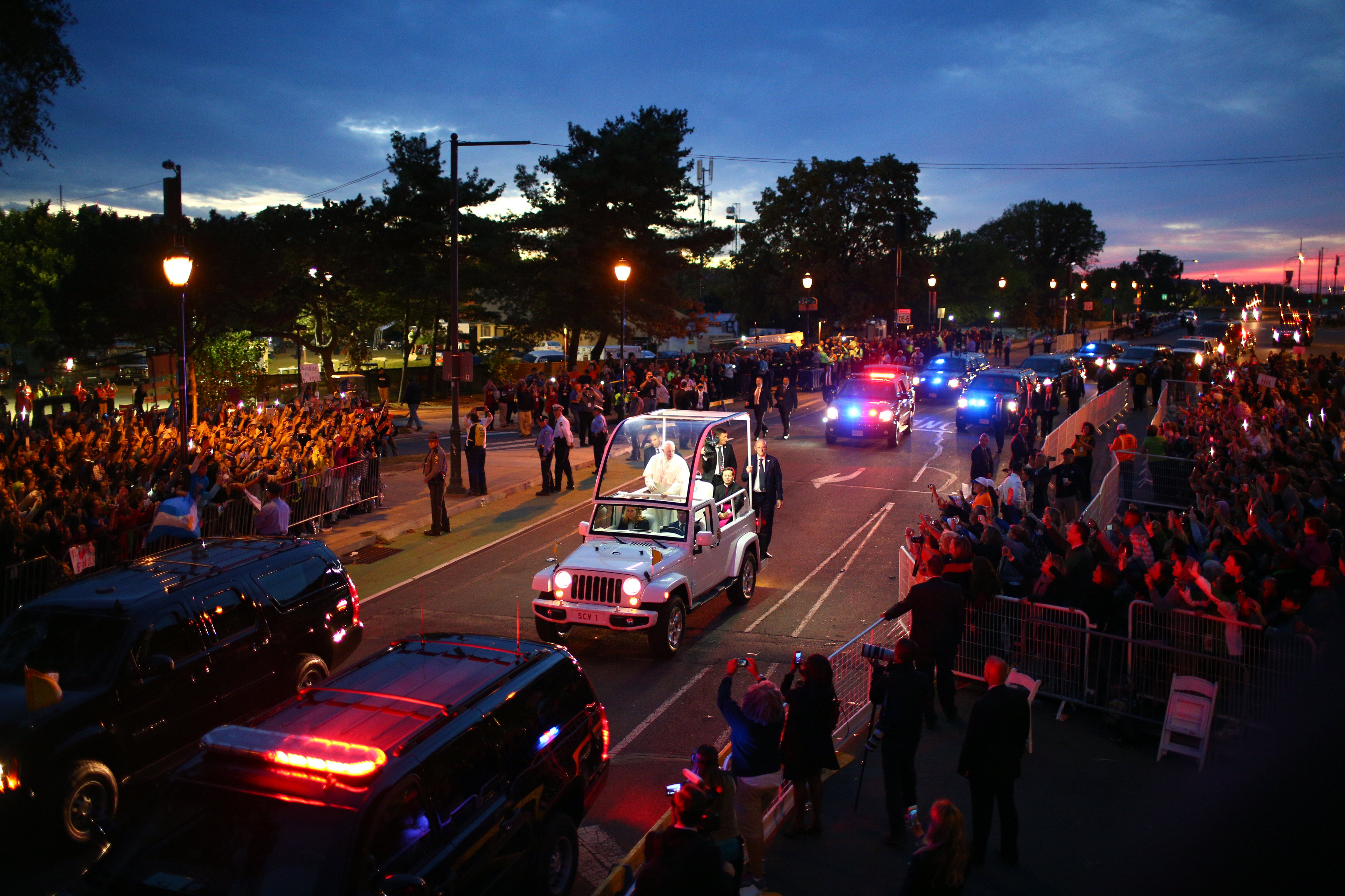 A crowd lines the street as Pope Francis is driven along Benjamin Franklin Parkway in Philadelphia on Sept. 26, 2015. Francis' transformative vision for the American church made it more open, but also energized conservative resistance that further divided it. (Eric Thayer/The New York Times)