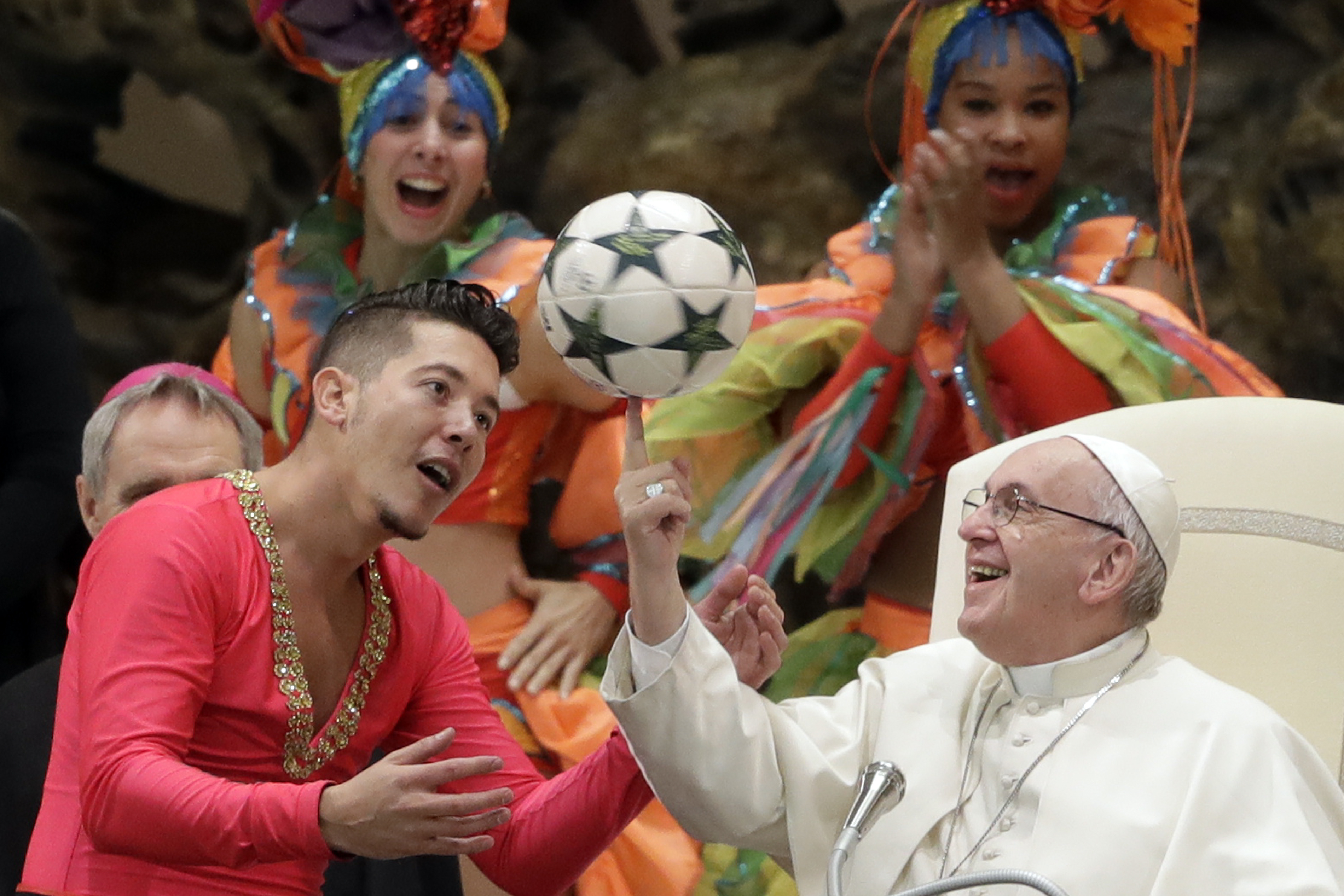 Pope Francis twirls a soccer ball he was presented by a member of the Circus of Cuba, during his weekly general audience in the Pope Paul VI hall, at the Vatican, Jan. 2, 2019. (Andrew Medichini/AP)