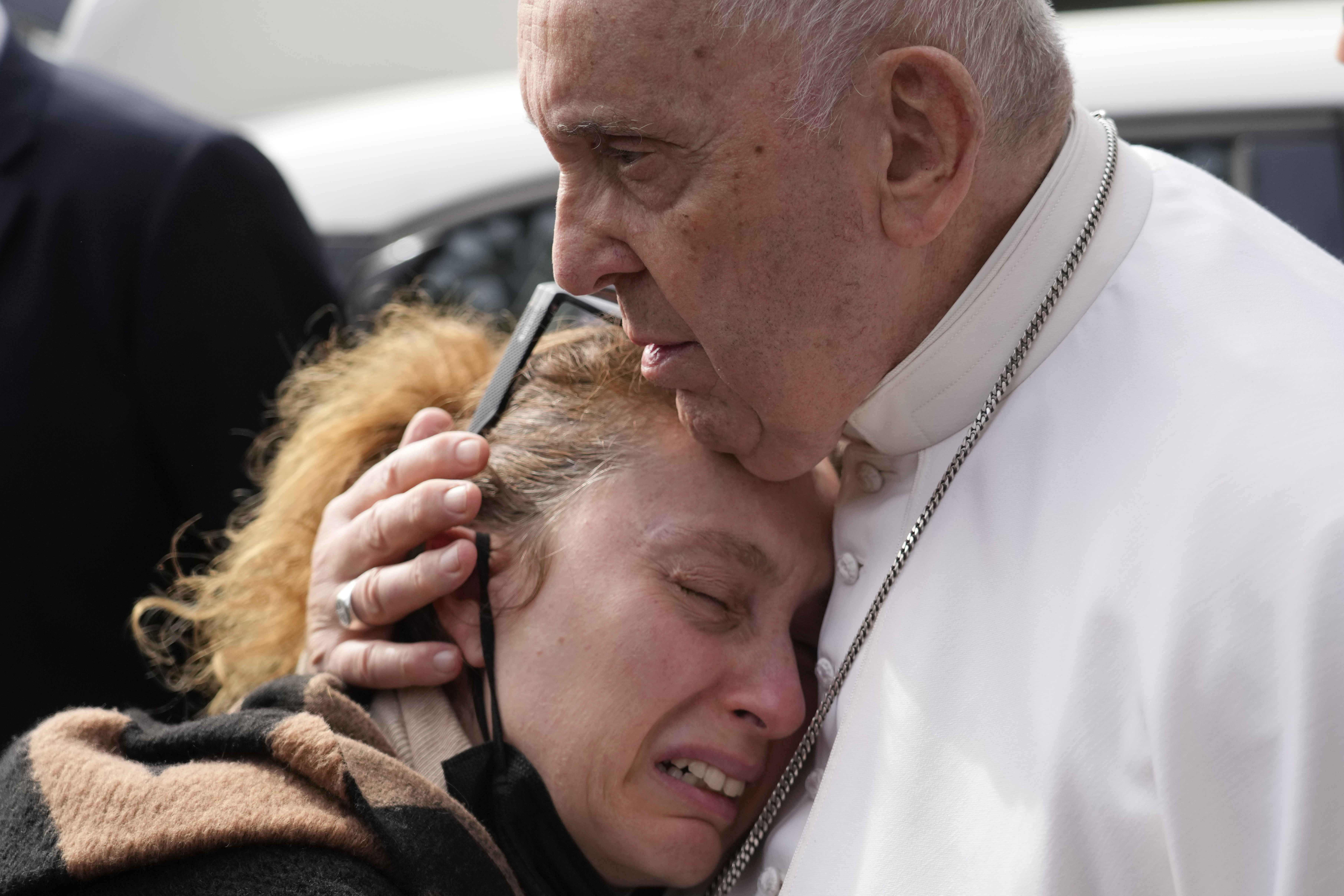 Pope Francis consoles Serena Subania who lost her daughter Angelica, 5 years old, the day before as he leaves the Agostino Gemelli University Hospital after receiving treatment for a bronchitis, in Rome, April 1, 2023. (Gregorio Borgia/AP)