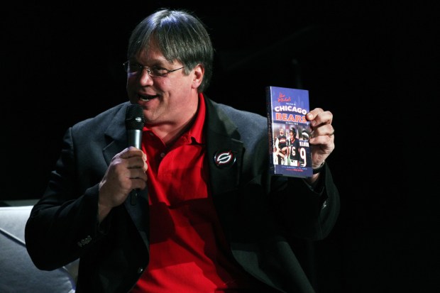 Steve McMichael shows off a copy of his book on the 1985 Chicago Bears during the Chicago Tribune's Chicago Live! event at the Chicago Theatre Downstairs on Feb. 10, 2011. (Chris Sweda/Chicago Tribune)