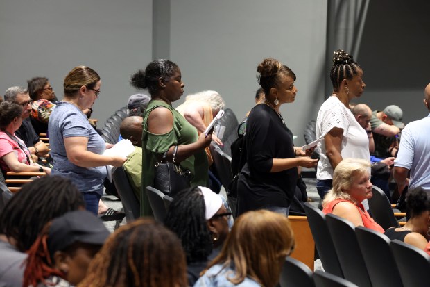 Residents wait to question Cook County Assessor Fritz Kaegi about property tax increases in the south suburbs at Thornton Fractional North High School in Calumet City on July 22, 2024. (Terrence Antonio James/Chicago Tribune)